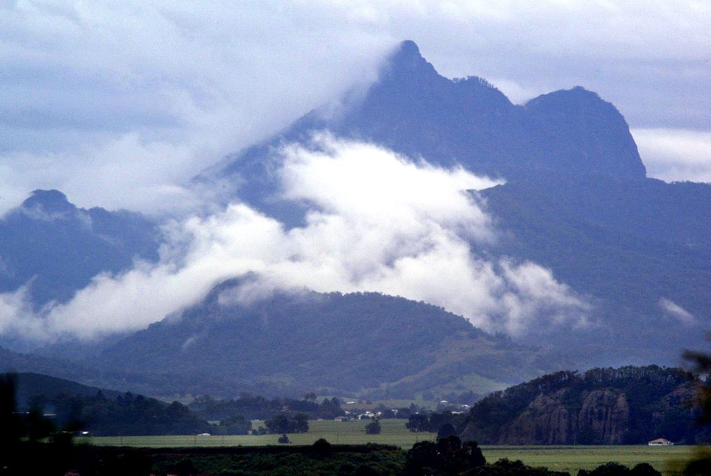 Rain clouds hover around Wollumbin (Mount Warning) in the Tweed Valley.